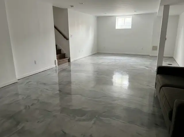 Basement floor with a glossy gray and white metallic epoxy coating (illustration)