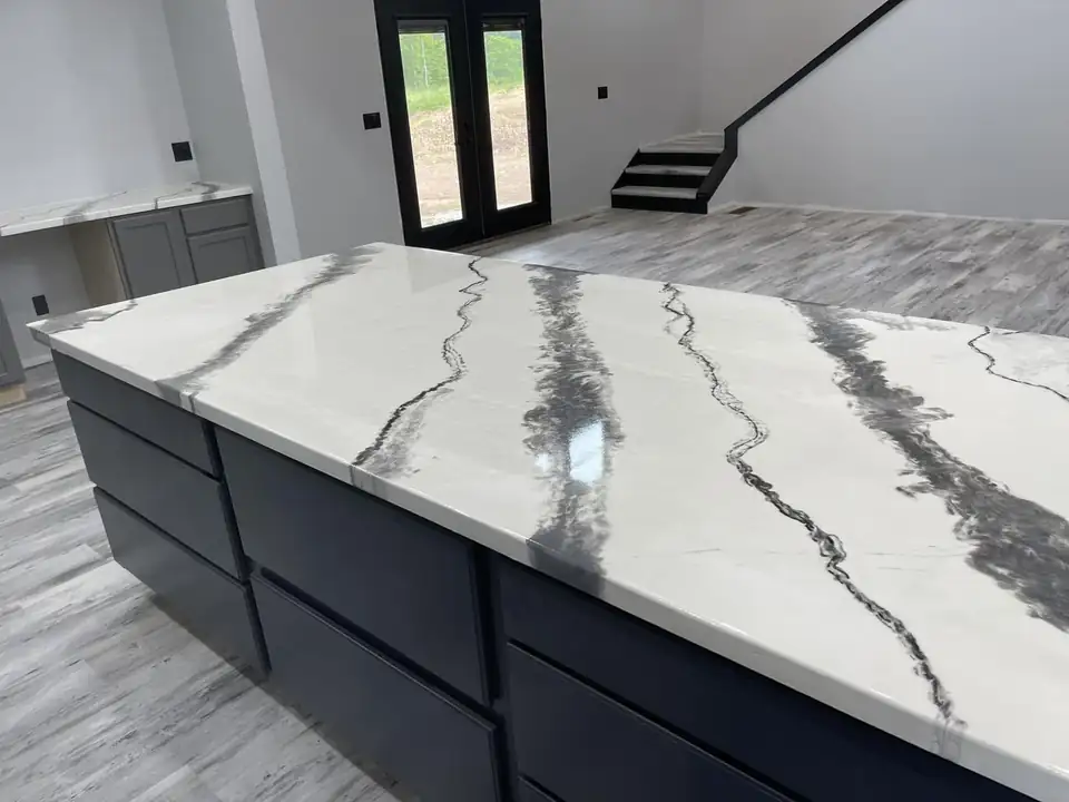 Epoxy countertops in Canonsburg: white epoxy island top with bold black veining over dark cabinets